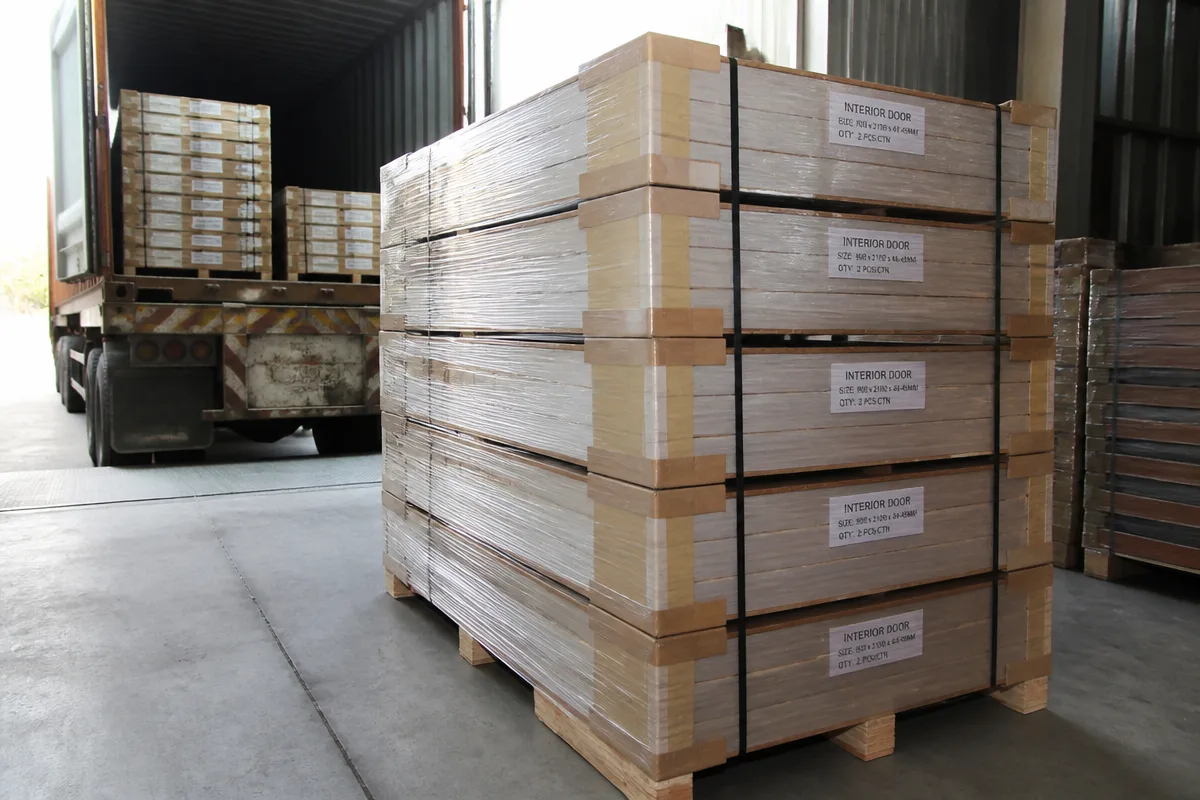 Packed door pallets staged for final loading and container seal