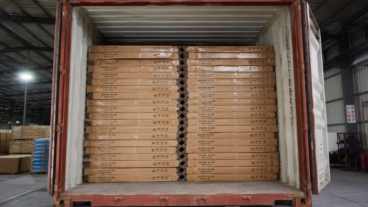 A 20ft container fully loaded with flat-packed interior door slabs