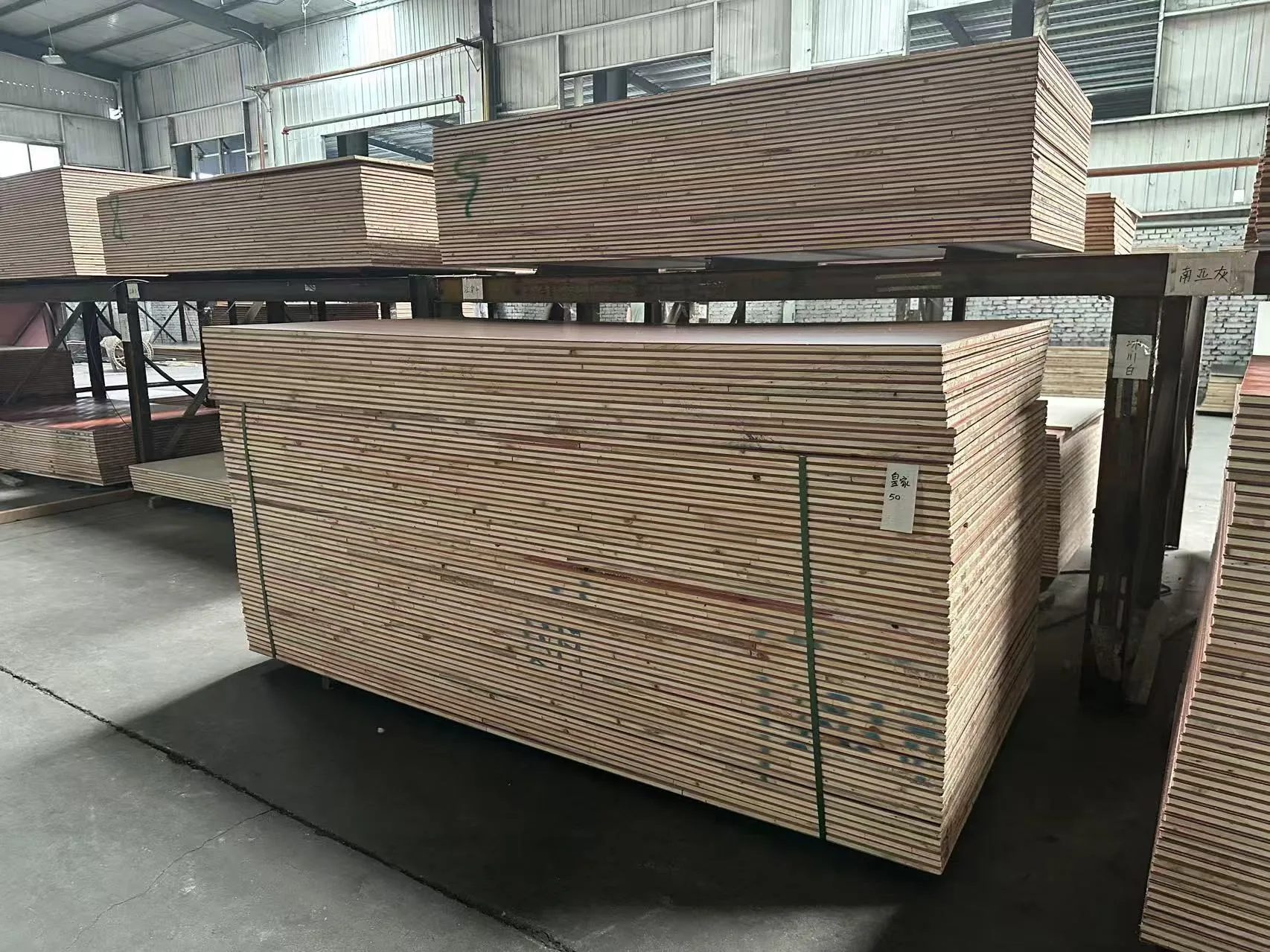 Stacked door core panels stored in a factory warehouse