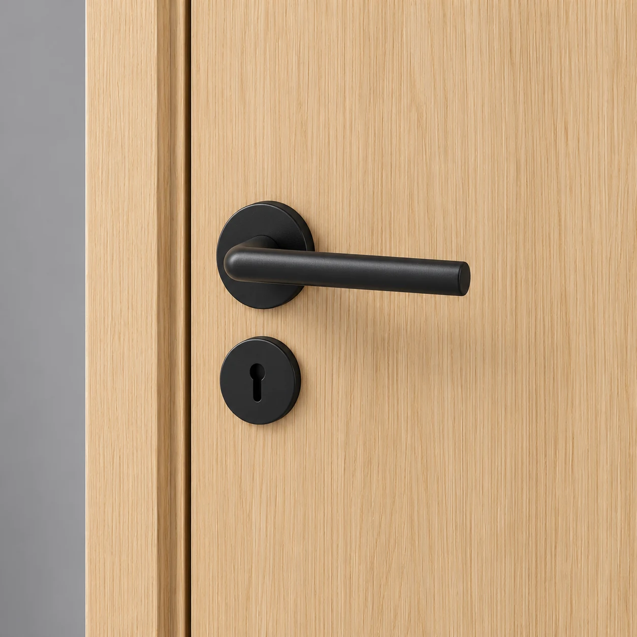Black lever and round lock on the light woodgrain door