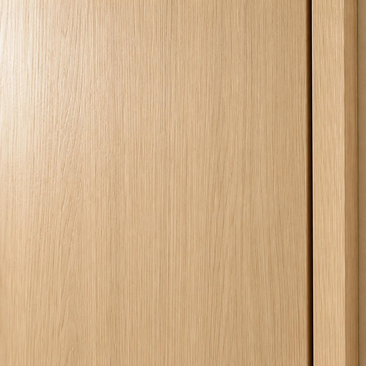 Close-up of fine vertical light woodgrain and door edge